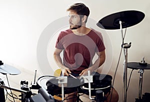 Drummer, man and music with percussion drums on stage, rhythm and talent with band. Creative person, practice and