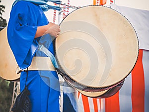 Drummer performance, Taiko Drum, Japanese folklore. Japanese artist perform at Bon Festival in blue kimono with big drum