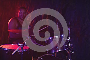 Drummer performing at music concert