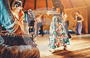 Drummer playing the djembe at the cacao ceremony. Ceremony dance in circle. Ceremony space.