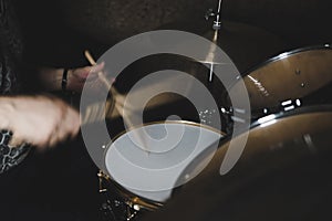 Drummer playing a drum kit