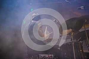 Drummer playing on stage at live concert