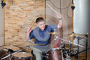 The drummer plays the drum kit