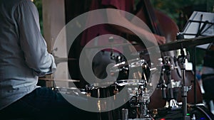 Drummer plays drums at a street festival.