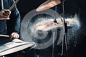 Drummer rehearsing on drums before rock concert. Man recording music on drum set in studio