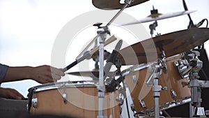 Drummer`s hands playing on drums.