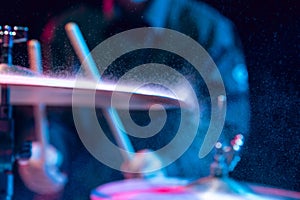 Drummer's rehearsing on drums before rock concert. Man recording music on drumset in studio