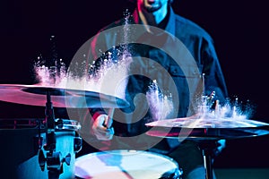 Drummer's rehearsing on drums before rock concert. Man recording music on drumset in studio