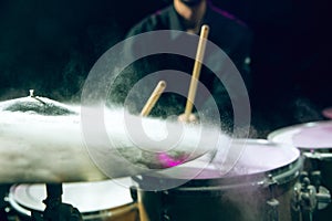 Drummer's rehearsing on drums before rock concert. Man recording music on drumset in studio