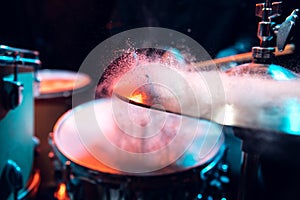 Drummer's rehearsing on drums before rock concert. Man recording music on drumset in studio