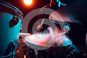 Drummer's rehearsing on drums before rock concert. Man recording music on drumset in studio