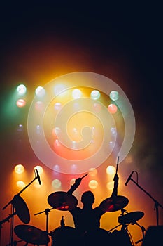 Drummer silhouette on a stage