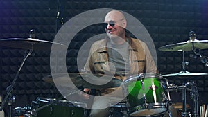 Drummer in sunglasses playing drums at performance