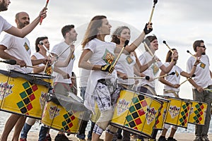 Drummers and musicians during outdoor fashion show with clothin