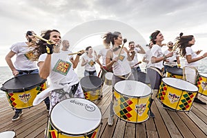 Drummers and musicians during outdoor fashion show with clothin