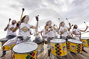 Drummers and musicians during outdoor fashion show with clothin