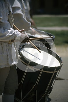 Drummers in white colonial uniforms