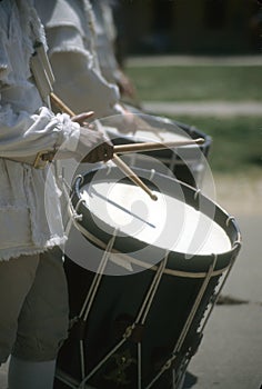 Drummers in white colonial uniforms