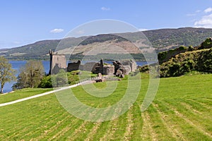 Urquhart Castle ruins on Loch Ness shore, embraced by Scottish Highlands