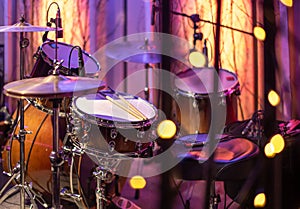 Drums, cymbals, hi hat on a beautiful background in the recording Studio. Room for musicians ` rehearsals. The concept of musical