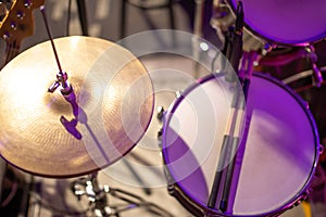 Drums, cymbals, hi hat on a beautiful background in the recording Studio. Room for musicians ` rehearsals. The concept of musical