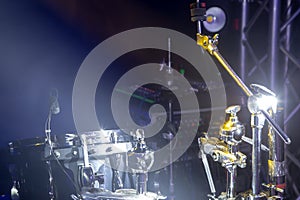 Drums and drum set. Beautiful blue and red background, with rays of light. Beautiful special effects of smoke and lighting