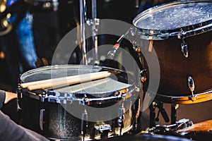 Drums and drumsticks on music stage