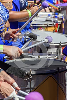 Drums played by women during a street carnival performance