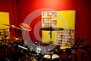 Red drums studio close-up in recording studio