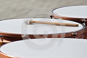 Drumsticks lying on timpani