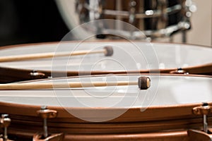 Drumsticks lying on timpani photo