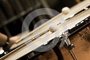 Drumsticks lying on timpani