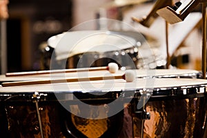 Drumsticks lying on timpani