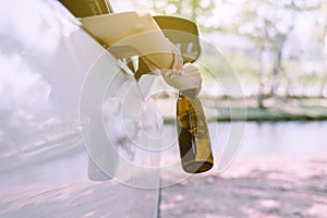 Drunk asian woman drinking alcohol while driving car on road,Women drive her car with a bottle of beer,Dangerous driving concept