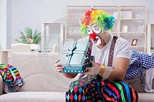The drunk clown celebrating having a party at home