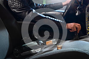 Drunk driving concept. Young man driving car under influence photo