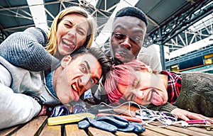 Drunk friends taking selfie with crazy funny faces at indoor event - Happy friendship concept on millenial people having fun