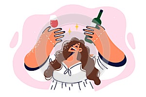 Drunk girl holding bottle of red wine and glass offering to drink during birthday party