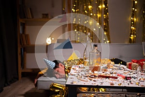 Drunk man sleeping on sofa after party at home