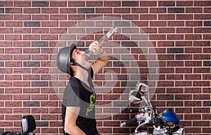 Drunk young man on his motorbike