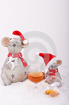 Drunken christmas mice with empty cognac glass