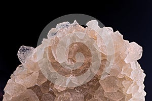 Druse calcite crystals on a black background