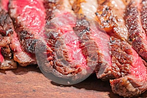 Dry-aged marble beef steak Tomahawk on wooden board with spices. Close-up, dinner concept