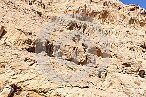 Dry, arid limestone mountains in the Valley of the Caves in Mleiha Archaeological Centre in Sharjah, United Arab Emirates