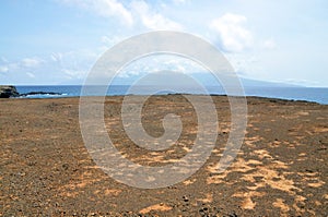 Dry, barren red dirt plateau on the islet of Djeu