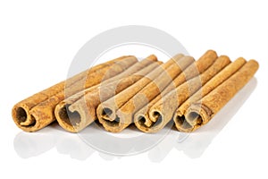 Dry brown cinnamon isolated on white