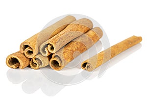 Dry brown cinnamon isolated on white