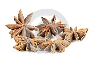 Dry brown star anise fruit isolated on white