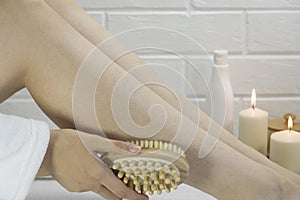 Dry brush massage. Preparing the skin for epilation. Exfoliation with a natural bristle brush. Strawberry legs, keratosis. Home