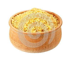 dry bulgur wheat in wooden bowl isolated on white background. top view